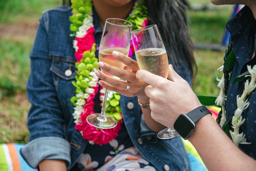 enjoying champagne toast with your loved one oahu rainbow helicopters