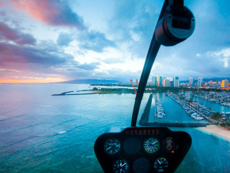 enjoy the tranquility of waikiki as the sun sets and the lights come on rainbow helicopters oahu hawaii