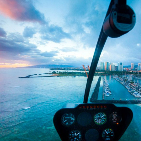 enjoy the tranquility of waikiki as the sun sets and the lights come on rainbow helicopters oahu hawaii