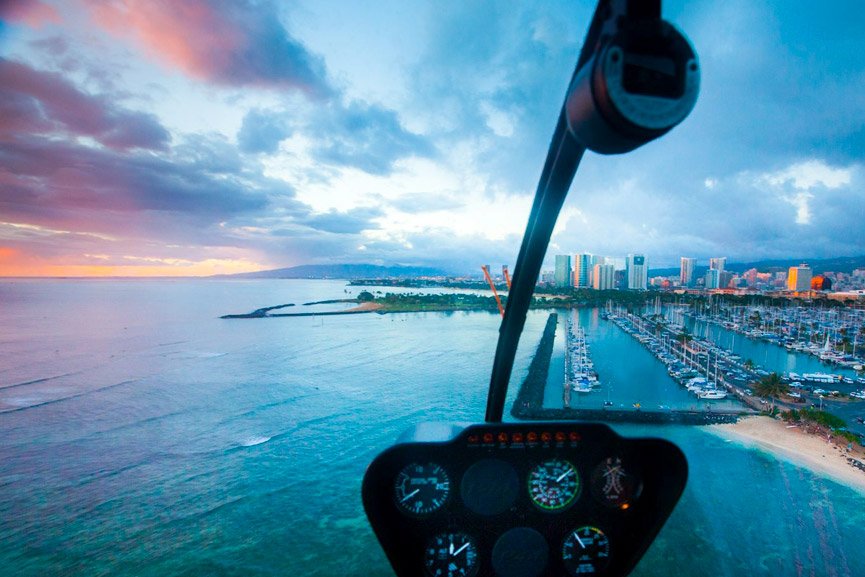 enjoy the tranquility of waikiki as the sun sets and the lights come on rainbow helicopters oahu hawaii