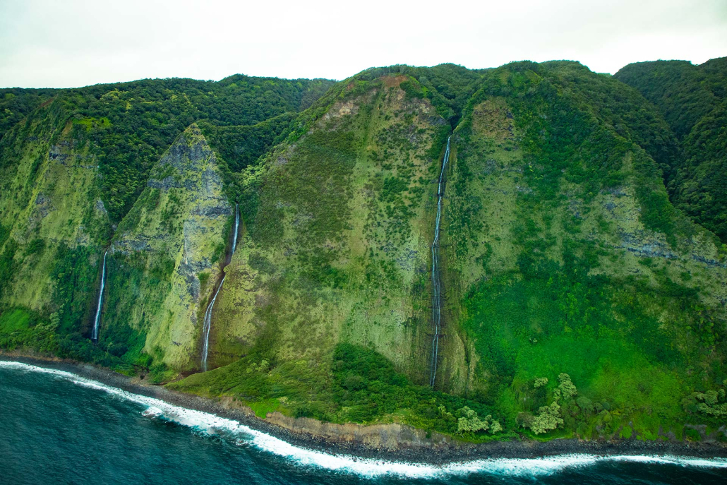 flying over the verdant rainforest and cascading waterfalls big island helicopter experience