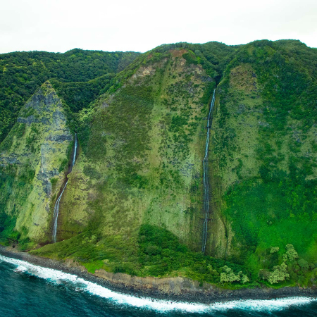 flying over the verdant rainforest and cascading waterfalls big island helicopter experience