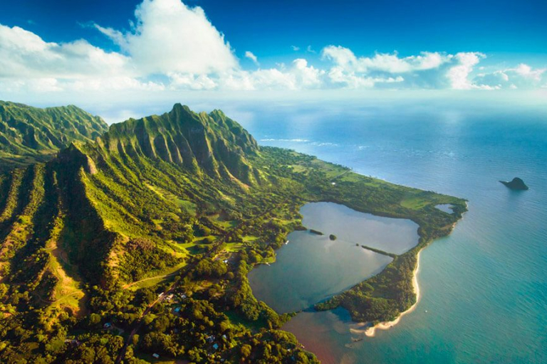 see the dramatic cliffs lush vegetation and sandy beaches rainbow helicopters oahu hawaii