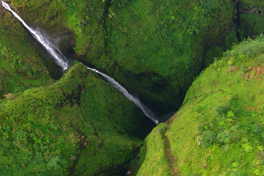 see the impressive streams of sacred falls rainbow helicopters oahu hawaii