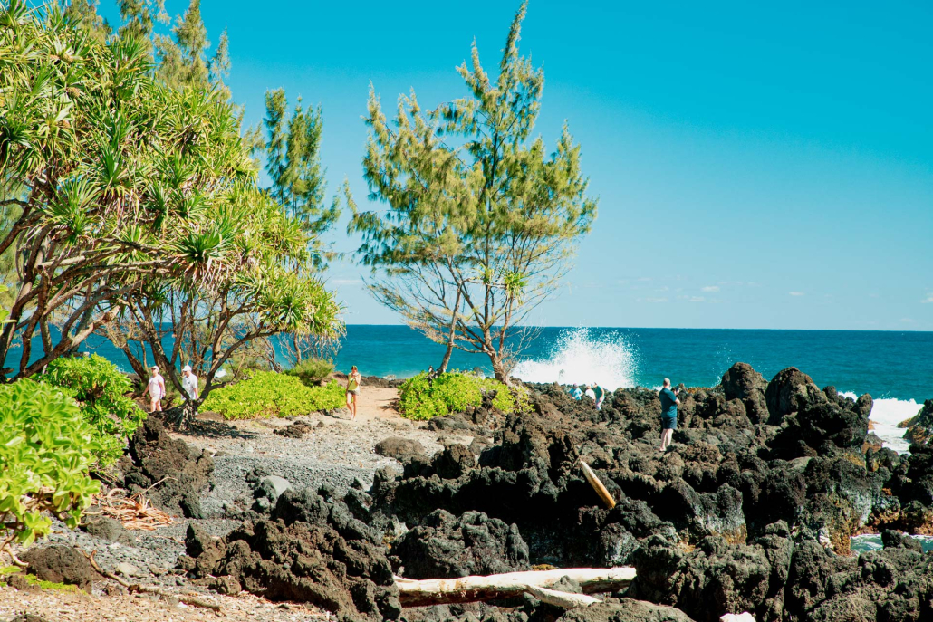 waves crash into lava rocks at the shore keanae peninsula maui hawaii